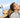 a picture with clear sky one man andone women dirking water from bottle and look satisfy